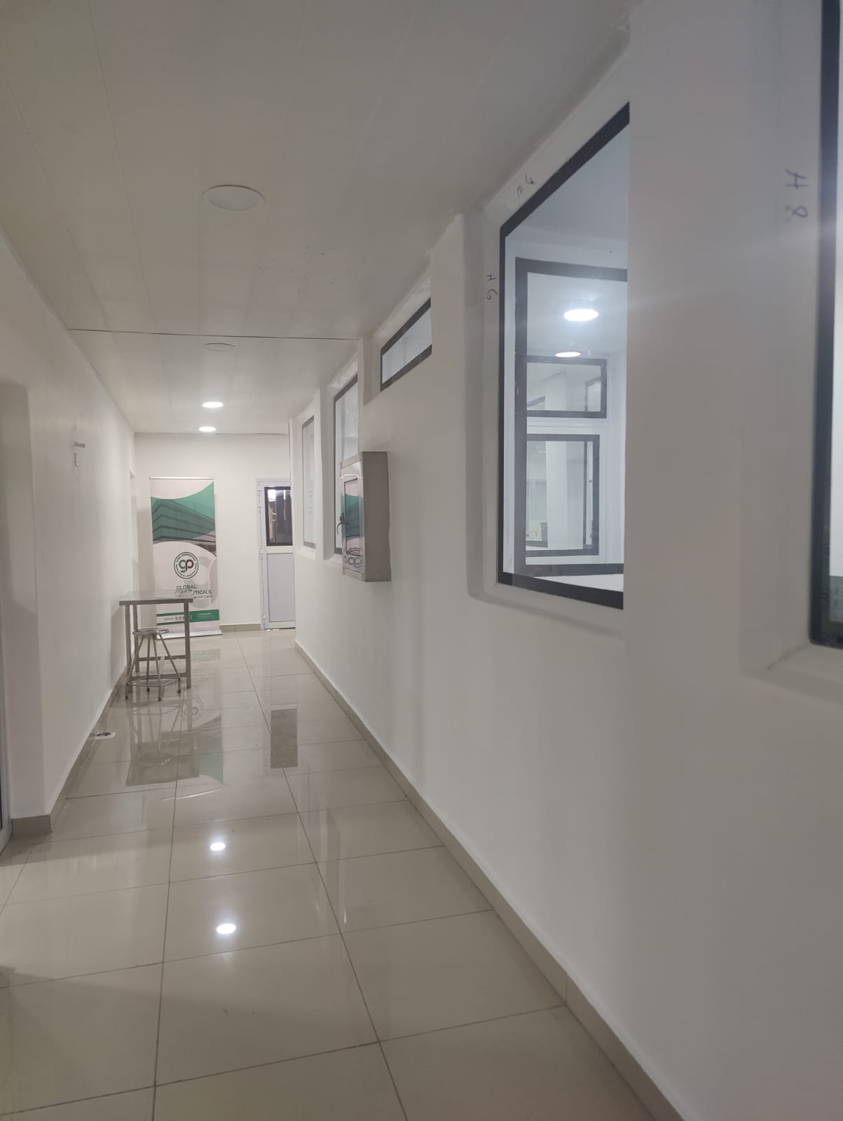 Main facility corridor with production viewing windows